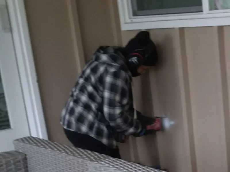 Professional electrician installing an exterior outlet in Glencoe
